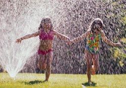 Girls Running Through Sprinkler.jpg
